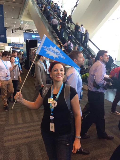 Awesome Admin holding a flag at Dreamforce. 