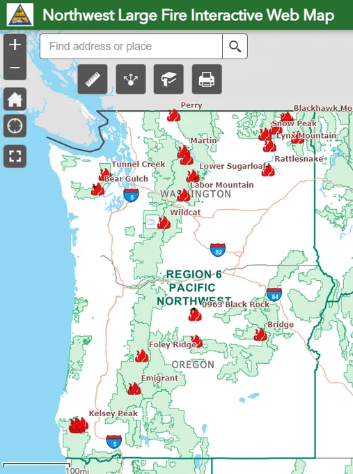 Colored map of Pacific Northwest uses red flame graphics to indicate numerous wildfire locations; large text at top reads 'Northwest Large Fire Interactive Web Map.'