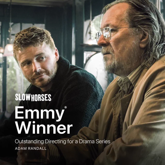 From Slow Horses. Jack Lowden as River Cartwright and Gary Oldman as Jackson Lamb sit next to each other. Jack glances over at Gary, who is looking straight ahead with a serious expression on his face. Text on image indicates that Slow Horses has won an Emmy for Outstanding Directing for a Drama Series.