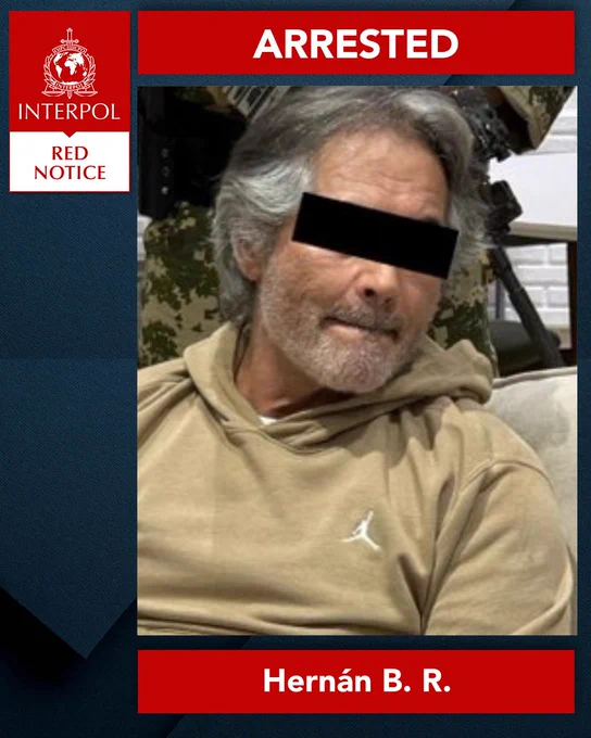 INTERPOL Red Notice poster with the word 'ARRESTED' displayed at the top. Features a photo of an individual named Hernán B. R.