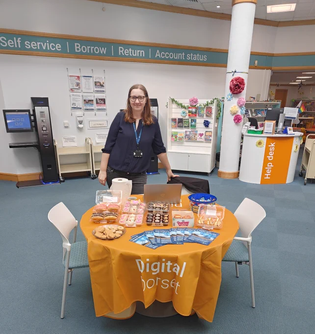 Table of goodies and leaflets at Weymouth Library.