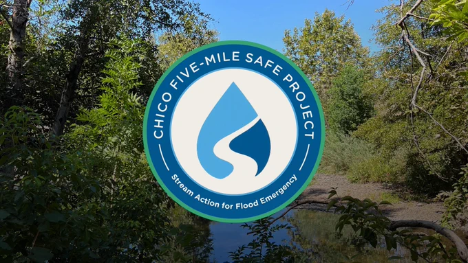 Photo of 5-mile basin with SAFE project logo in the center. The circular logo contains a drop of water with a stream going through it. The text on the logo reads, "Chico five-mile safe project. Stream action for flood emergency.