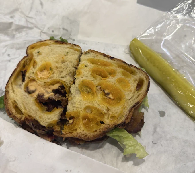 A picture of a blt and pickle sphere