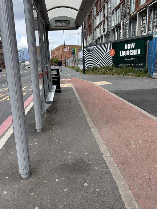 Bus stop showing narrow width allocated for passengers to wait.