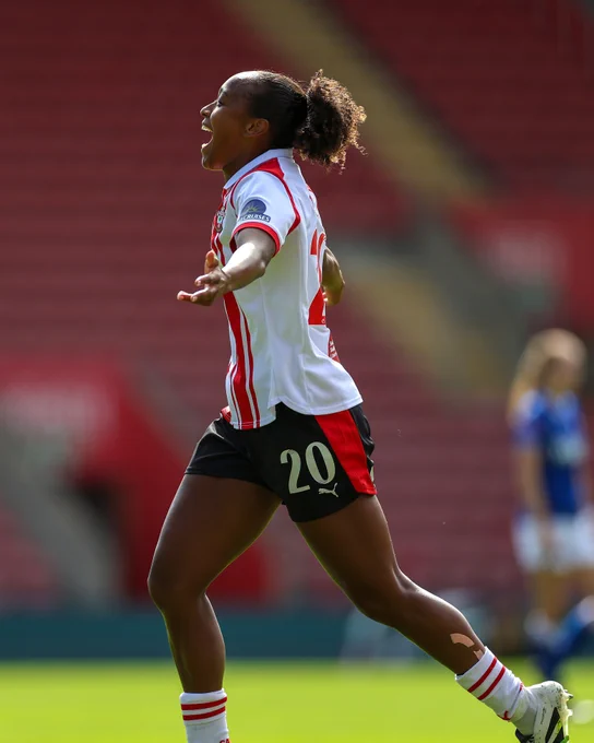 Atlanta Primus celebrates scoring against Ipswich Town at St Mary's Stadium in the red and white home kit