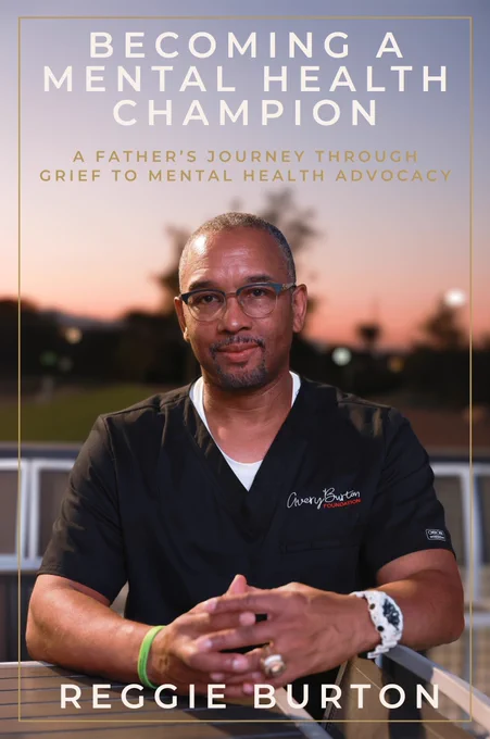 Reggie Burton's new book cover that reads "Becoming A Mental Health Champion: A Father's Journey Through Grief to Mental Health Advocacy" at the top and "Reggie Burton" at the bottom of the image. Centered is Reggie Burton seated at a table. 