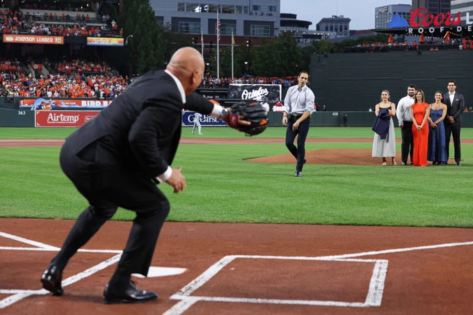 Ryan Ripken throws a first pitch to Cal Ripken, Jr.