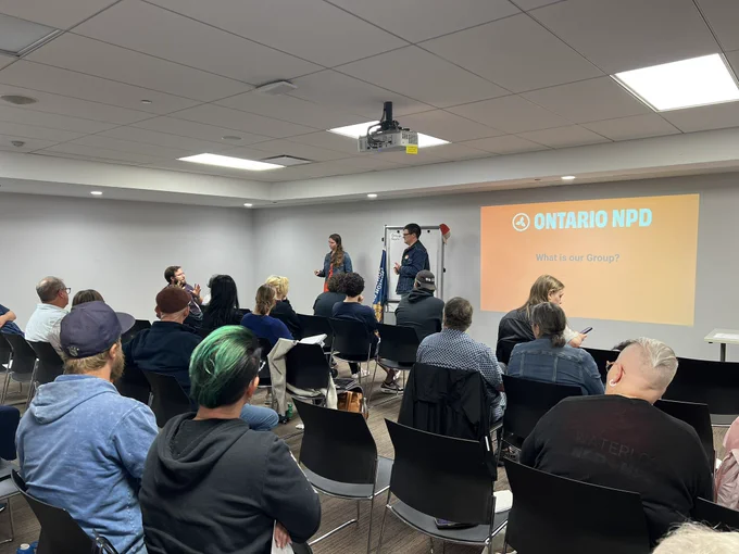 NDP members in a meeting room