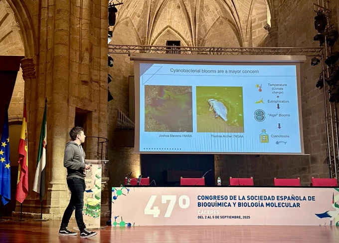 Explaining the impact of cyanobacterial blooms and introducing our target enzyme GuaB3 during my oral presentation at the 47th SEBBM Congress.