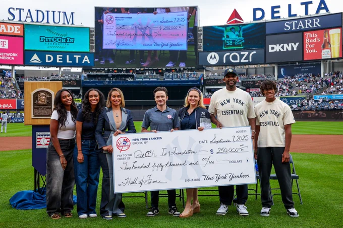 The Yankees present a check to the PitCCh In Foundation. 