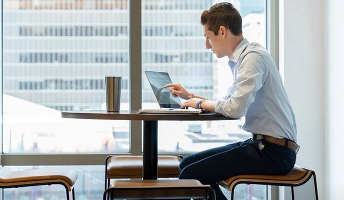 Student using a computer while in Manhattan