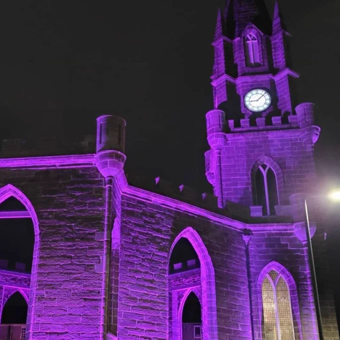buildings lit up purple for pancreatic cancer awareness