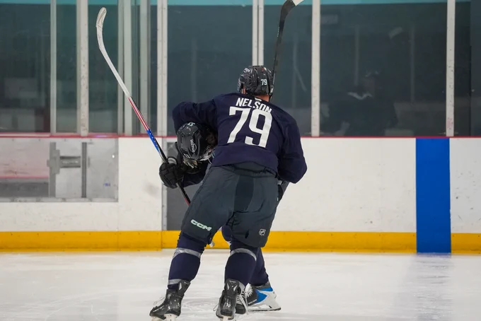 Photo of Ty Nelson and Blake Fiddler horsing around during practice.