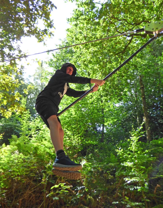 teenagers enjoying a zip wire
