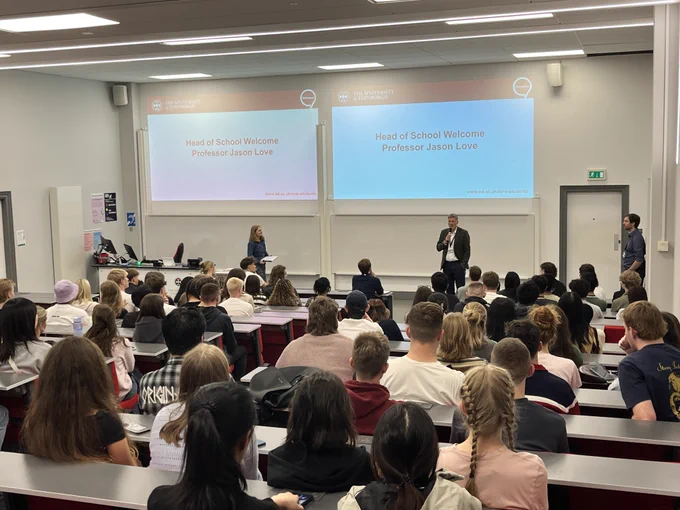 Welcome talk at the University of Edinburgh School of Chemistry with Head of School Prof Jason Love (centre), Director of Teaching Prof Carole Morrison (left) and Director of Students Dr David August (right) on stage.