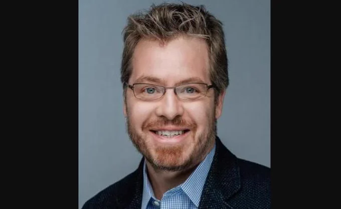 A headshot portrait of University of Guelph marketing professor Dr. Timothy Dewhirst