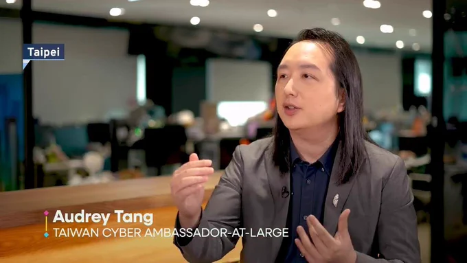 Audrey Tang, Taiwan’s cyber ambassador, first digital minister and architect of the Taiwan Model of digital diplomacy, gesticulates during an interview for the TaiwanPlus program small island BIG IDEAS.