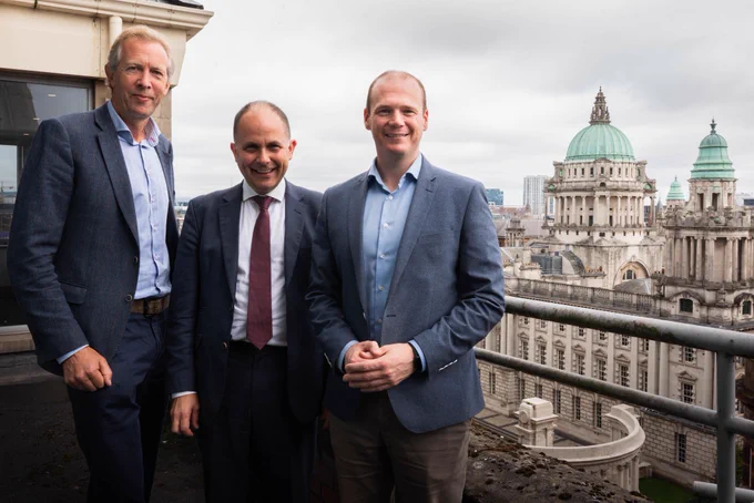 Minister Lyons photographed with representatives from Historic Houses, with City Hall in the background.