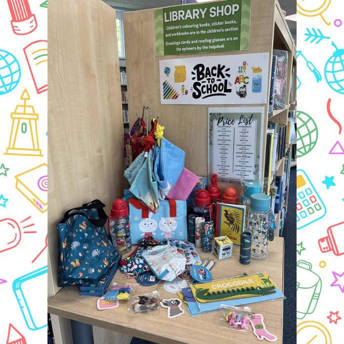 Photograph of the Back To School themed sales display / library shop at Ash Library on a back to school themed background. 