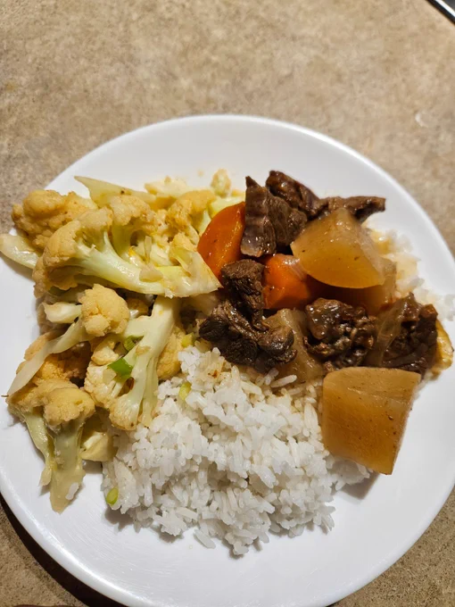 Dinner as described served on a round white soup plate.