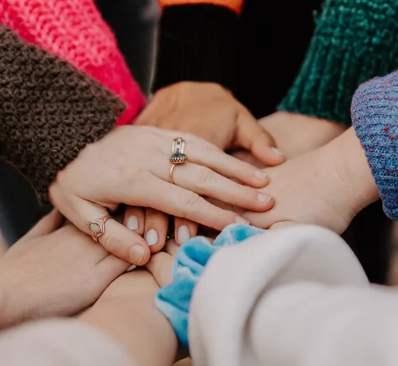 People putting their hands together