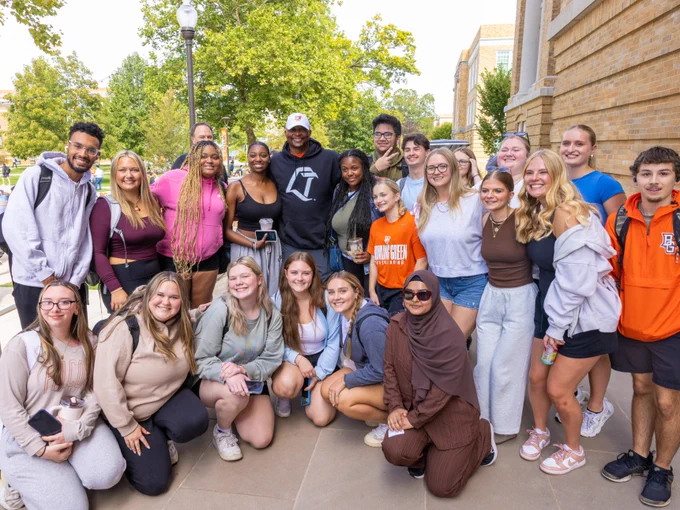 Group photo of students with Eddie George in the middle.