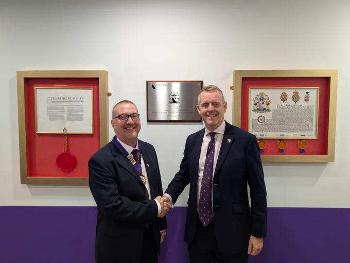 Newly appointed President, Dr Ian Higginson (left), shaking hands with Immediate Past President Dr Adrian Boyle at RCEM HQ.