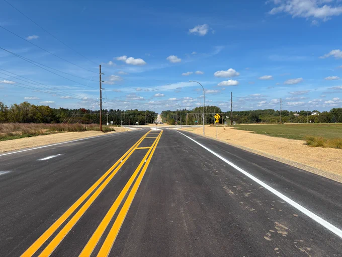 Photo of northbound Olmsted County Road 112 going into the Highway 63 roundabout.