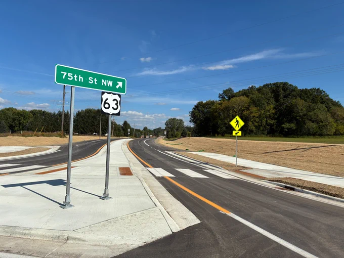 A photo of the roundabout turn onto eastbound Highway 63/75th St. NW.