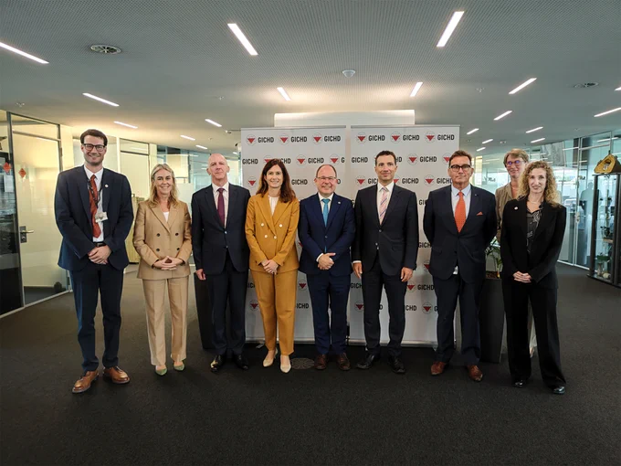 At the GICHD office: Five GICHD colleagues stand for photo with Ambassador Julien Thöni, Swiss Permanent Representative for Disarmament, Maja Riniker, President of the Swiss National Council, Andrea Caroni, President of the Swiss Council of States.