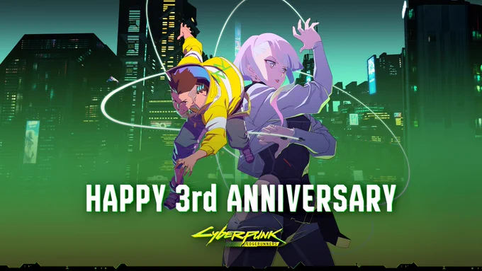 Characters David and Lucy from Cyberpunk: Edgerunners pose together against a backdrop of the Night City skyline. David, on the left, is in an action pose, as if running, while Lucy stands tall and brandishes Monowire from her wrist implants. The white wires arch around both characters. Text below them reads, “Happy Third Anniversary, Cyberpunk: Edgerunners.”