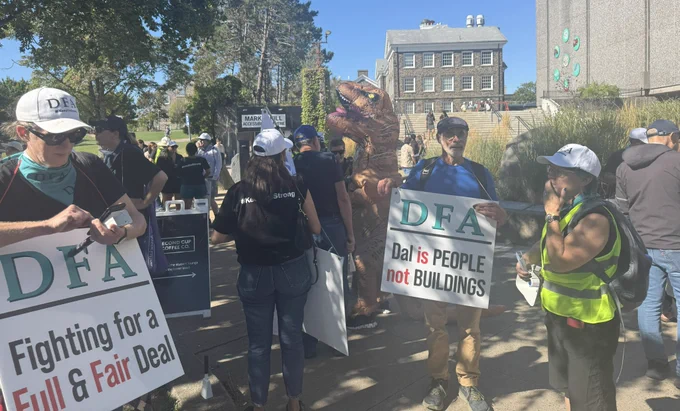 photo of DFA picketer getting reach for a march with their signs
