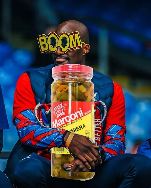 J.P. Mateta with his "BOOM" glasses holding a giant jar of giardiniera.