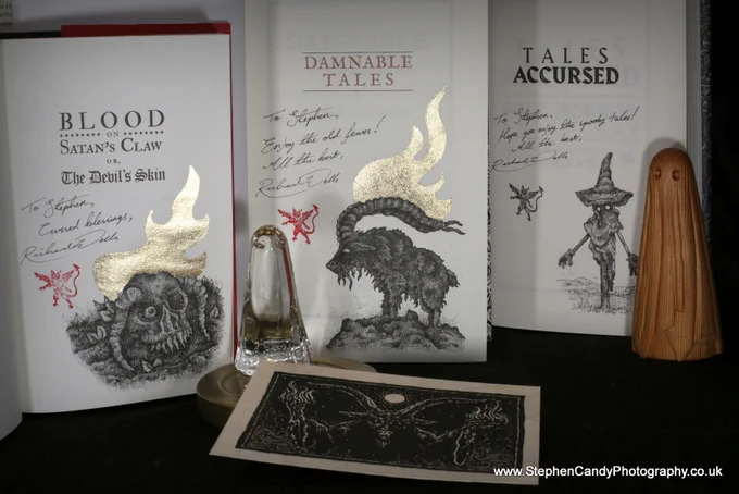 Remarqued copies of "Blood on Satan's Claw", "Damnable Tales" and "Tales Accursed" all illustrated by Richard Wells, seen with a glass York Ghost and a carved Keith Wells wooden ghost.