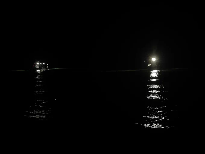 two police boats in the water, 7:58 PM CT