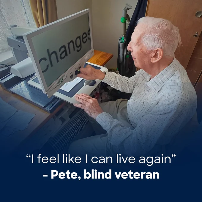 Pete, a blind veteran, sits at a desk in his home using an electronic magnifier. The screen shows large, magnified text. The overlaid text reads: “I feel like I can live again.”