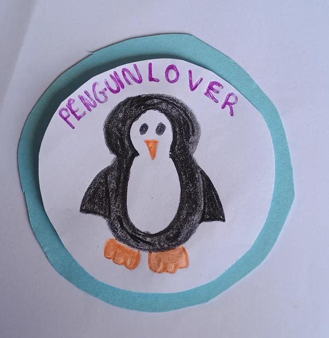 Hand-drawn penguin with the words 'Penguin Lover' written in purple, inside a blue circle