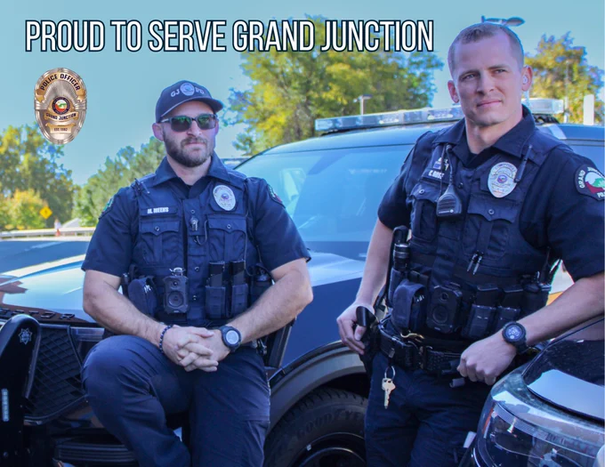 Two officers looking off camera