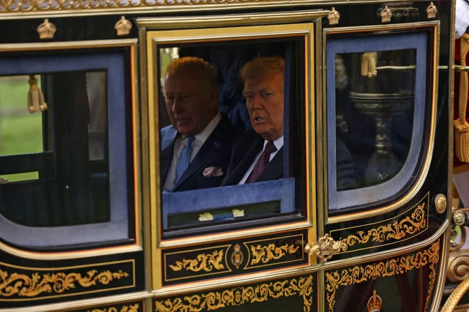 His Majesty The King and President Trump seen inside in their carriage during the carriage procession. 
