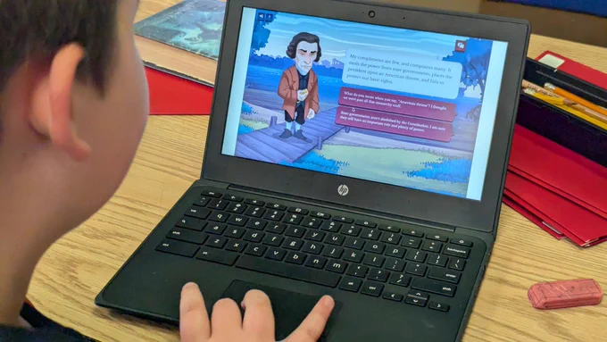 Student on a Chromebook reading about the Constitution 