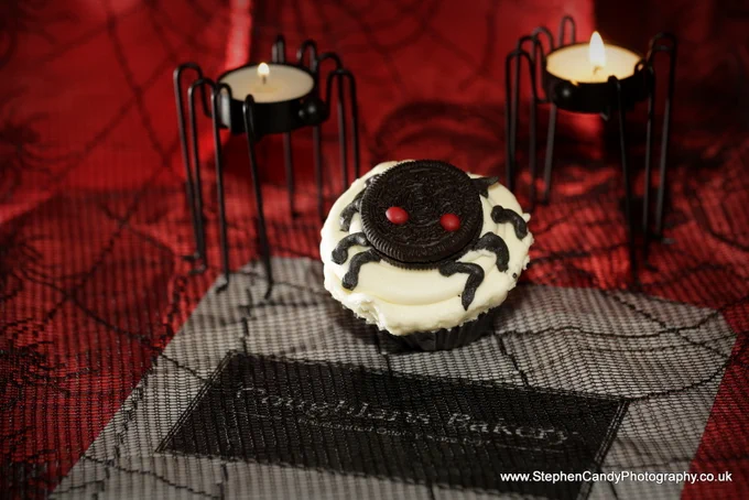 Coughlans Oreo spider cupcake in front of spider candles!