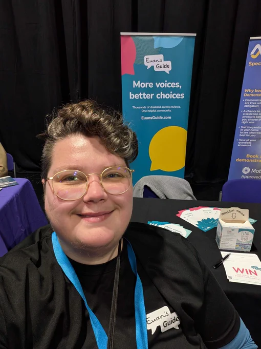 A selfie of Pat in front of the Euan's Guide stand at Digby Brown event