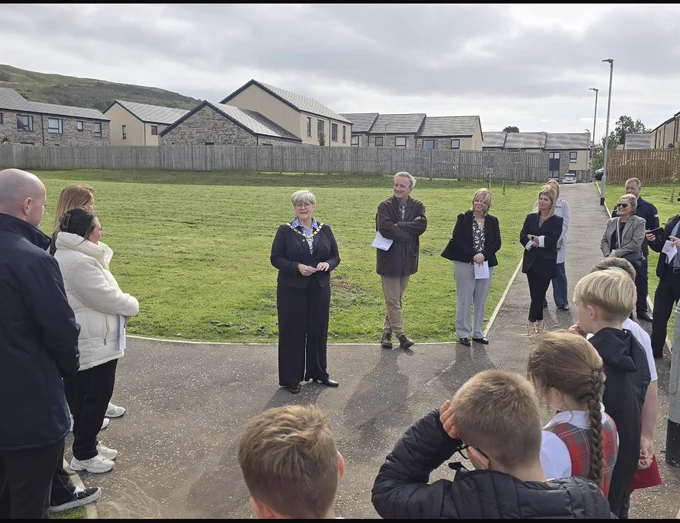 Provost Dickson welcomes guests to the housing opening. ceremony