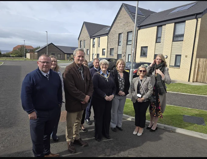 Guests assemble at new houses, Councillor Alan Hill (second from left) next to Provost Dickson and North Ayrshire Council Head of Housing, Yvonne Baulk