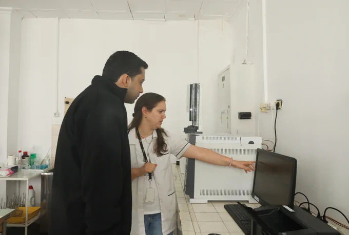 DEA Senior Forensic Chemist Jonathan Duffy is conducting a hands-on lab review with a Bulgarian chemist. 