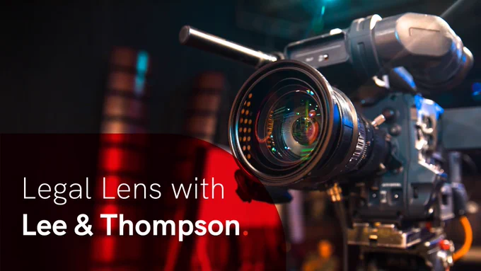 Close-up of a professional video camera lens capturing vibrant reflections in a dimly lit studio setting. In the bottom left is a semi-opaque curved red overlay with the words 'Legal Lens with Lee & Thompson' in white.