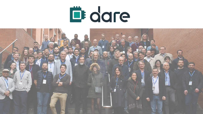 Photo of members of the DARE consortium at the kick-off meeting in March 2025 with the DARE logo 