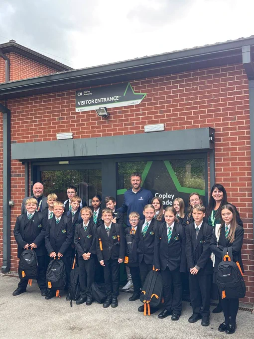 Michael Carrick and a group of school pupils.