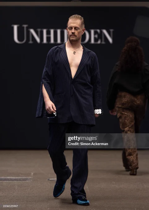 Paul “Stumpy” Davies, Welsh presenter on S4C’s Heno and disability & LGBTQ  advocate, modelling at London Fashion Week with Unhidden. The runway showcases adaptive, inclusive fashion by designer Victoria Jenkins, promoting accessibility, queer visibility, and Welsh representation on an international stage.