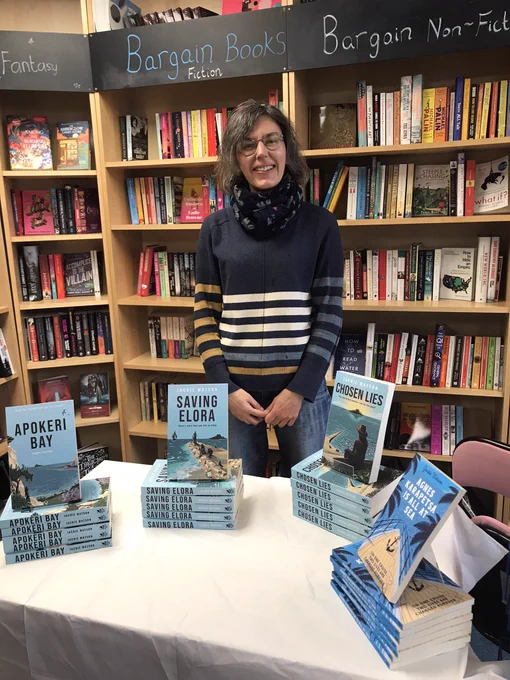 Smiling author with her Apokeri Bay series books inside Book Corner at Saltburn by the Sea